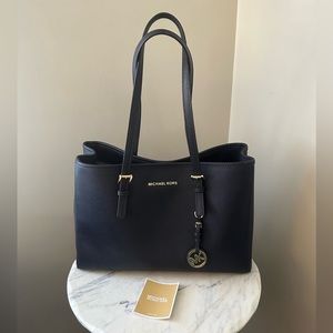Michael Kors Navy handbag.